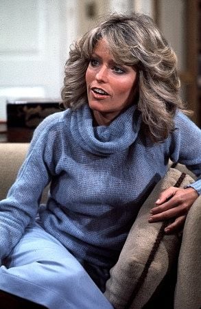 Quem é o cara com Farah Fawcett?